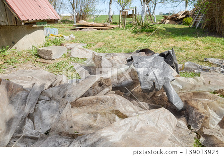 Old, torn plastic bags on the ground, hazardous waste. Old, torn plastic bags on the ground, hazardous waste. 139013923