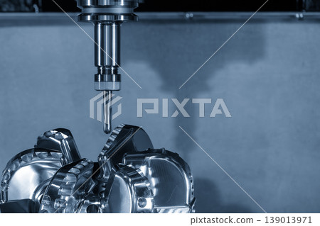 Precision CNC milling process finishing a high-quality drill bit part using a ball nose end mill tool. Precision CNC milling process finishing a high-quality drill bit part using a ball nose end mill tool. 139013971