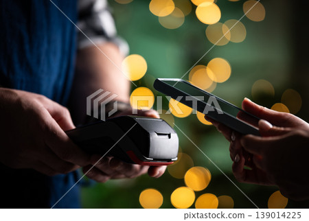 Waiter Holding Pos Payment Terminal While Girl Pays For Bill Waiter Holding Pos Payment Terminal While Girl Pays For Bill 139014225