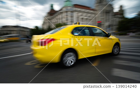 Rushing Yellow Taxi Car Driving Fast By City Road Rushing Yellow Taxi Car Driving Fast By City Road 139014240