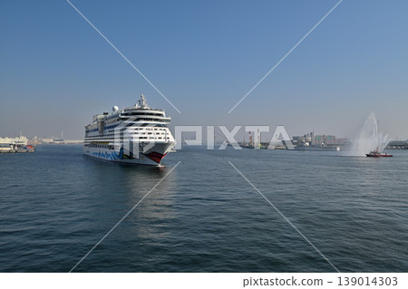The luxury cruise ship "AIDA Diva" is welcomed with a colored water cannon from a fireboat upon entering Kobe Port. The luxury cruise ship "AIDA Diva" is welcomed with a colored water cannon from a fireboat upon entering Kobe Port. 139014303