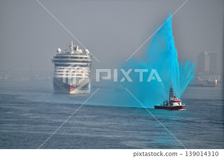 The luxury cruise ship "AIDA Diva" is welcomed with a colored water cannon from a fireboat upon entering Kobe Port. The luxury cruise ship "AIDA Diva" is welcomed with a colored water cannon from a fireboat upon entering Kobe Port. 139014310