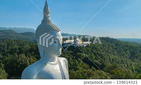Aerial view of big Buddha of Wat Phra That Pu Jae in Phrae 139014321