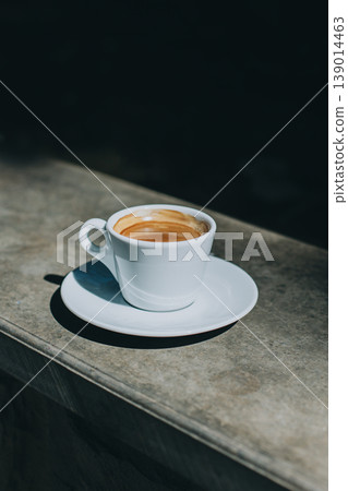 Cup of black coffee in a street cafe. Cup of black coffee in a street cafe. 139014463