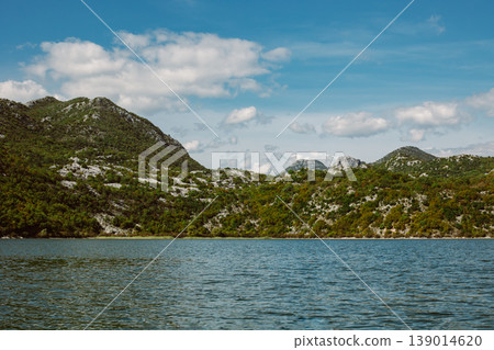 Amazing view of Skadar Lake and beautiful mountains on a sunny morning. Amazing view of Skadar Lake and beautiful mountains on a sunny morning. 139014620