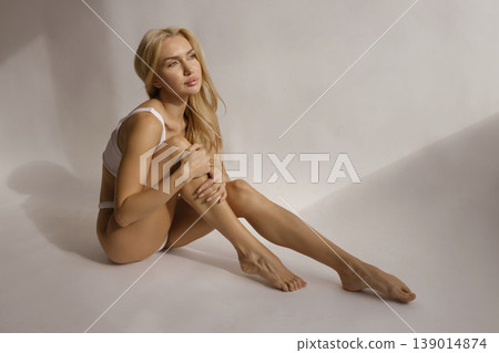 Smooth female legs and attractive body after hair removal, beauty skin care and epilation concept in studio light 139014874