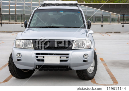 The front of a four-wheel drive vehicle with the steering wheel turned The front of a four-wheel drive vehicle with the steering wheel turned 139015144