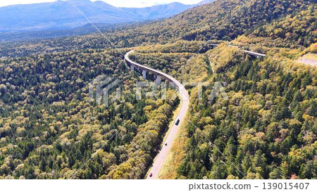 [Aerial View] A spectacular autumn landscape representative of Hokkaido! A grand panorama overlooking Mikuni Pass and Matsumi Ohashi Bridge. 139015407