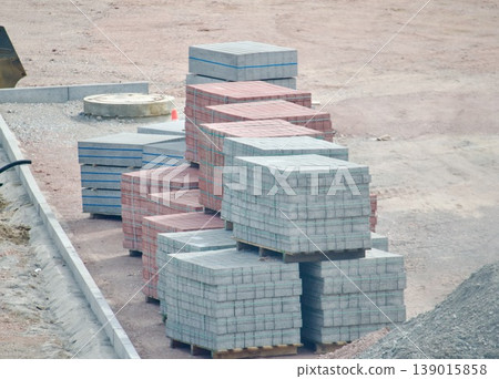 Stacks of paving slabs on a construction site. Paving stones prepared for urban landscaping. 139015858
