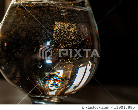 A glass of water in the setting sun A glass of water in the setting sun 139015990