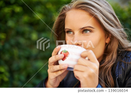 Woman, thinking and relax with coffee in garden to drink, espresso or latte outdoor in morning. Calm, happiness and person with tea, cup and brunch in summer with freedom, peace or planning day 139016034