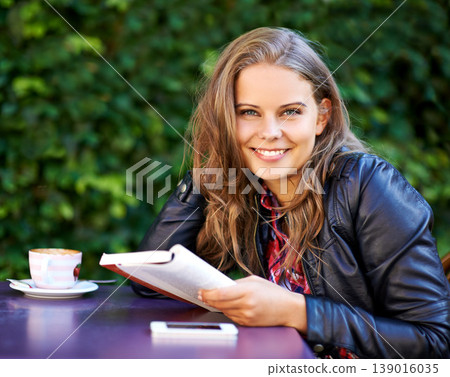 College student, portrait and reading a book at coffee shop on university, campus or restaurant. Happy, woman and learning from studying books, textbook or relax with knowledge at outdoor cafe 139016035