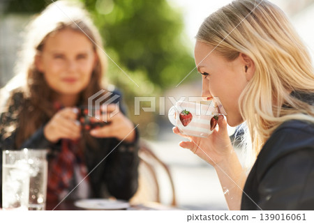 Women, friends and drinking coffee at shop, meeting and reunion together. Girls, people and tea cup at cafe, restaurant table and customer enjoying latte at cafeteria store to relax outdoor in city Women, friends and drinking coffee at shop, meeting and reunion together. Girls, people and tea cup at cafe, restaurant table and customer enjoying latte at cafeteria store to relax outdoor in city 139016061