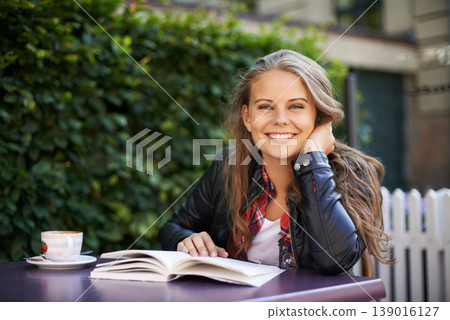 Happy woman, portrait and reading a book at cafe, outdoor and coffee shop with espresso, latte or beverage. Girl, smile and relax with green tea, drink or english literature in morning at city bistro Happy woman, portrait and reading a book at cafe, outdoor and coffee shop with espresso, latte or beverage. Girl, smile and relax with green tea, drink or english literature in morning at city bistro 139016127