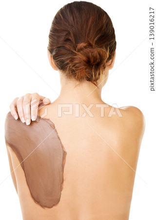 Mud, skincare and treatment on back of woman with detox or cosmetics in white background or studio. Natural, dermatology and person with application of dirt, care or exfoliate skin and body in spa Mud, skincare and treatment on back of woman with detox or cosmetics in white background or studio. Natural, dermatology and person with application of dirt, care or exfoliate skin and body in spa 139016217
