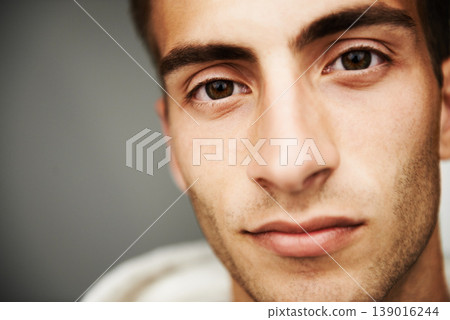Portrait, male student and fashion with closeup in studio for cool, trendy or mockup for vision on gray background. Spain, young man and confidence with look on face for streetwear, clothes or casual Portrait, male student and fashion with closeup in studio for cool, trendy or mockup for vision on gray background. Spain, young man and confidence with look on face for streetwear, clothes or casual 139016244