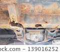 The frame of the car is corroded by rust. 139016252