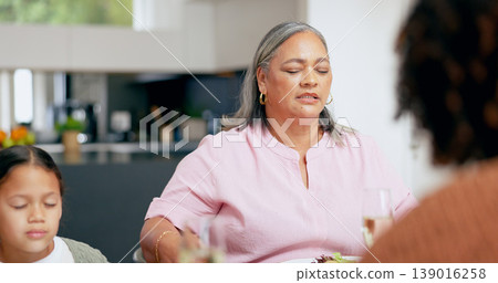 Praying, senior woman and family at table for dinner, lunch or breakfast and holding hands for grace. Christian, religion and grandmother with girl giving gratitude, prayer or thank you god for food Praying, senior woman and family at table for dinner, lunch or breakfast and holding hands for grace. Christian, religion and grandmother with girl giving gratitude, prayer or thank you god for food 139016258
