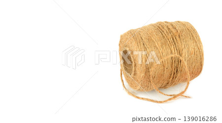 Natural brown hemp rope roll with copy space. Natural brown hemp rope roll with copy space. 139016286