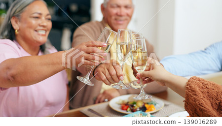 Family, hands and champagne toast for holiday celebration, thanksgiving and thank you or congratulations. Happy senior people with wine glasses, drinks or alcohol for party, lunch and success at home Family, hands and champagne toast for holiday celebration, thanksgiving and thank you or congratulations. Happy senior people with wine glasses, drinks or alcohol for party, lunch and success at home 139016289