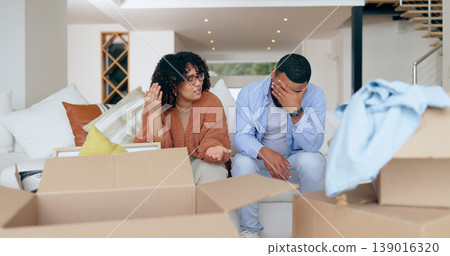 New home, box and frustrated couple on sofa for house, property investment and moving day. Conflict, argue and man and woman with crisis, problem and fight for mortgage, rent and real estate purchase New home, box and frustrated couple on sofa for house, property investment and moving day. Conflict, argue and man and woman with crisis, problem and fight for mortgage, rent and real estate purchase 139016320