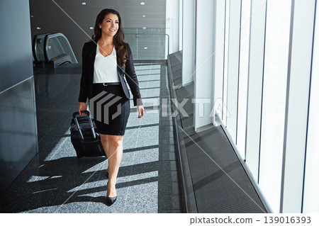 Walking, thinking or happy employee in airport on business trip with suitcase, baggage or luggage. Smile, entrepreneur or corporate woman by window in lobby for travel journey on international flight Walking, thinking or happy employee in airport on business trip with suitcase, baggage or luggage. Smile, entrepreneur or corporate woman by window in lobby for travel journey on international flight 139016393