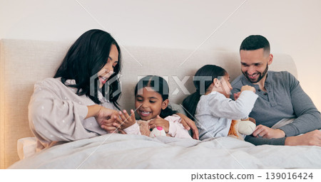 Family, home and parents with children in bed for bonding, sleeping together and conversation. Night, support and happy mother, father and kids in bedroom talking for love, care and relax on weekend Family, home and parents with children in bed for bonding, sleeping together and conversation. Night, support and happy mother, father and kids in bedroom talking for love, care and relax on weekend 139016424