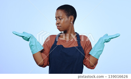 Woman, cleaner and gloves with hands, question and confused for cleaning service and blue studio background. Housekeeper, maintenance and doubt for hygiene, decision and hand gesture for mockup space Woman, cleaner and gloves with hands, question and confused for cleaning service and blue studio background. Housekeeper, maintenance and doubt for hygiene, decision and hand gesture for mockup space 139016626