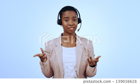 Call center, studio or portrait of black woman in communication, speaking or talking. Blue background, virtual assistant or African financial advisor with microphone in CRM for support or business Call center, studio or portrait of black woman in communication, speaking or talking. Blue background, virtual assistant or African financial advisor with microphone in CRM for support or business 139016628