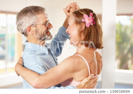 Senior couple, dancing and happy in house, love and ballroom for fun, touch and romantic. Retirement, bonding together and smile for husband, wife and flower with tango, retired or elderly people Senior couple, dancing and happy in house, love and ballroom for fun, touch and romantic. Retirement, bonding together and smile for husband, wife and flower with tango, retired or elderly people 139016694
