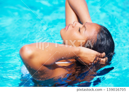 Woman, outdoor and relax in swimming pool, summer and hair with thinking, ideas and memory on vacation. Girl, water and sunshine with peace, calm and wellness on holiday with freedom in Indonesia 139016705