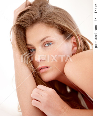 Bed, morning and portrait of woman with beauty for sensual, flirting and sleeping at home. Serious, attitude and face closeup of person in bedroom with confidence, pride and relax in apartment 139016746