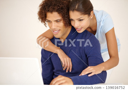 Hug, happy and couple on laptop for online shopping, browse internet and social networking together. Dating, love and man and woman embrace on computer for reading website, streaming service and blog Hug, happy and couple on laptop for online shopping, browse internet and social networking together. Dating, love and man and woman embrace on computer for reading website, streaming service and blog 139016752
