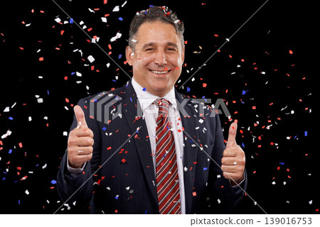Business man, thumbs up and confetti for celebration, success and winning, thank you or support in election in studio. Portrait of professional winner in suit, like emoji and vote on black background Business man, thumbs up and confetti for celebration, success and winning, thank you or support in election in studio. Portrait of professional winner in suit, like emoji and vote on black background 139016753