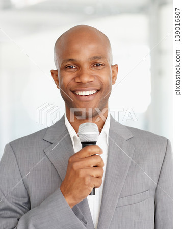 African man, microphone and portrait with smile, speaking and working at event, happy and employee. Speech, career and workplace for corporate seminar, speaker and hosting for business conference 139016807