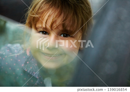 Portrait, smile and a girl in a car for a road trip to travel as a passenger on holiday or vacation. Kids, face and a happy young girl child in a vehicle to drive for transport closeup on the weekend 139016854