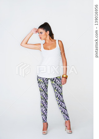 Woman, fashion and face for thinking to side in studio for trendy, cool or idea in mock up. Female model, hand or gesture with pose for funky, edgy and clothes for style on white background in Spain Woman, fashion and face for thinking to side in studio for trendy, cool or idea in mock up. Female model, hand or gesture with pose for funky, edgy and clothes for style on white background in Spain 139016956