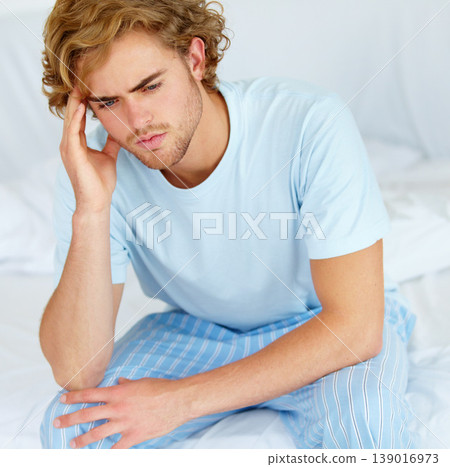 Stress, thinking and exhausted with a man on his bed in the morning to wake up feeling moody. Depression, mental health or burnout with a tired young person alone in the bedroom of his apartment Stress, thinking and exhausted with a man on his bed in the morning to wake up feeling moody. Depression, mental health or burnout with a tired young person alone in the bedroom of his apartment 139016973