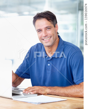 Portrait, happy man and laptop in modern office for startup for profession, career or choice with job. Mature person, entrepreneur and business in digital marketing with technology, computer and web 139016974