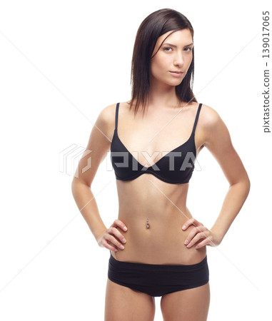 Young woman, portrait and underwear in lose weight, slim body or diet against a white studio background. Attractive female person or model in lingerie, bikini or posing for detox, health and wellness 139017065