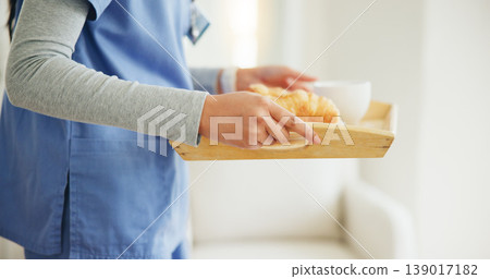 Woman, hands and nurse with breakfast tray in elderly care, support or volunteer at home. Closeup of female person, medical doctor or caregiver holding snack, meal or service for healthy nutrition 139017182