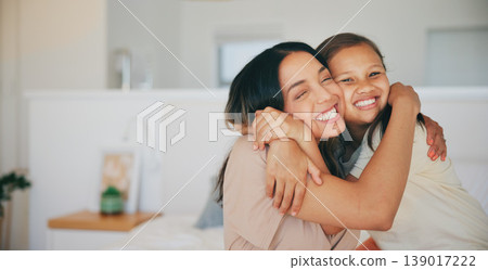 Face, smile and a mother hugging her daughter in the bedroom of their home in the morning together. Family, love and a happy young girl embracing her single parent while on a bed in their apartment Face, smile and a mother hugging her daughter in the bedroom of their home in the morning together. Family, love and a happy young girl embracing her single parent while on a bed in their apartment 139017222