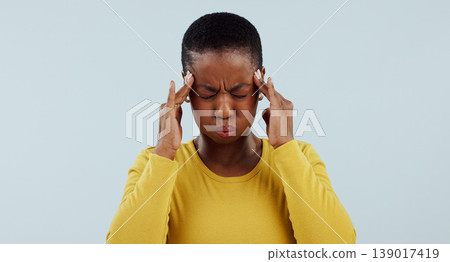 Frustrated black woman, headache and stress in anxiety, burnout or mistake against a gray studio background. African male person with migraine or mental health in pain, pressure or fail on mockup Frustrated black woman, headache and stress in anxiety, burnout or mistake against a gray studio background. African male person with migraine or mental health in pain, pressure or fail on mockup 139017419