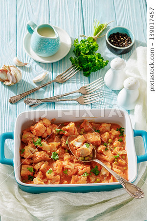 Indian fish curry with cauliflower and green peas Indian fish curry with cauliflower and green peas 139017457