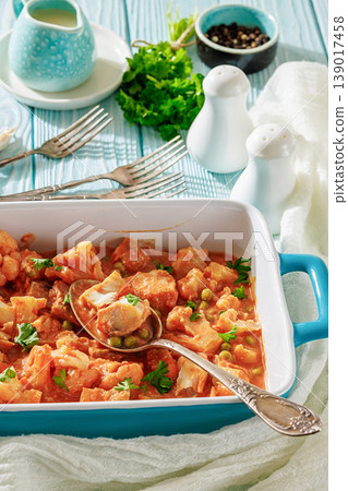 Indian fish curry with cauliflower and green peas Indian fish curry with cauliflower and green peas 139017458