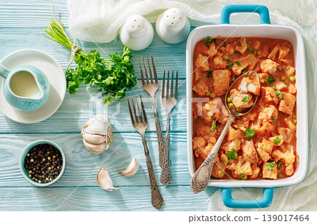 Indian fish curry with cauliflower and green peas Indian fish curry with cauliflower and green peas 139017464