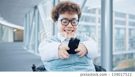 Phone, office and business woman in wheelchair online for social media, networking and connection. Modern workplace, corporate and person with disability in corridor on smartphone for mobile app Phone, office and business woman in wheelchair online for social media, networking and connection. Modern workplace, corporate and person with disability in corridor on smartphone for mobile app 139017522