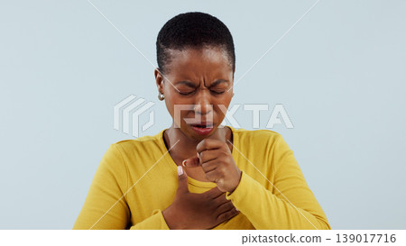 Healthcare, allergies and cough, black woman in studio with lung disease, asthma or chest pain. Tuberculosis, covid virus or breathing problem, sick person with medical emergency on white background. Healthcare, allergies and cough, black woman in studio with lung disease, asthma or chest pain. Tuberculosis, covid virus or breathing problem, sick person with medical emergency on white background. 139017716