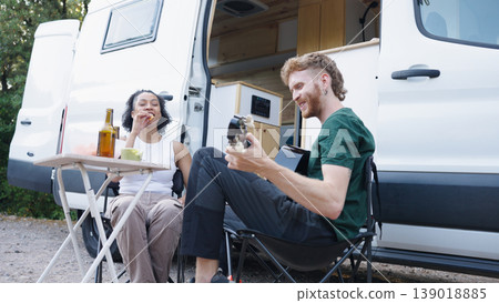 Couple enjoying remote camping life playing guitar 139018885