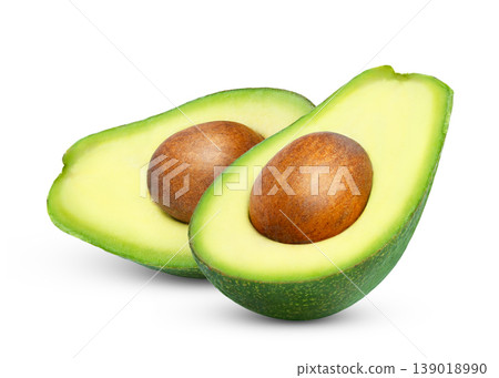 Cut in a halves of avocado isolated. Green avocado half with clipping path. Cut in a halves of avocado isolated. Green avocado half with clipping path. 139018990